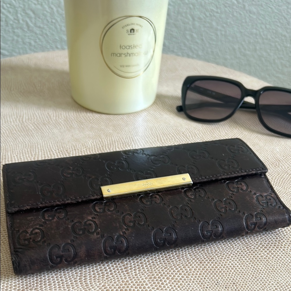 Gucci Brown Wallet with Signature Monogram and Flap Closure